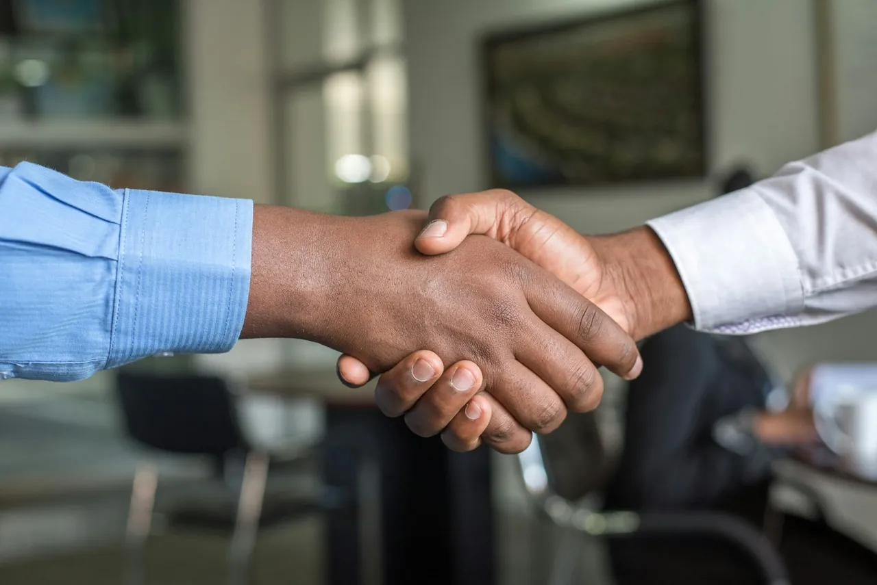 Professional handshake representing permanent staffing partnerships